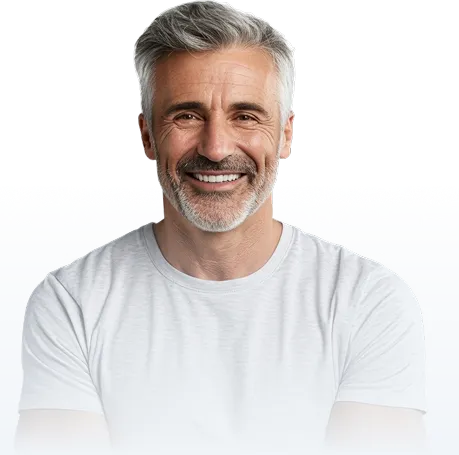 A smiling middle-aged man with gray hair and a beard, wearing a white t-shirt.